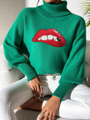 Green turtleneck sweater with sequin red lips detail and balloon sleeves.