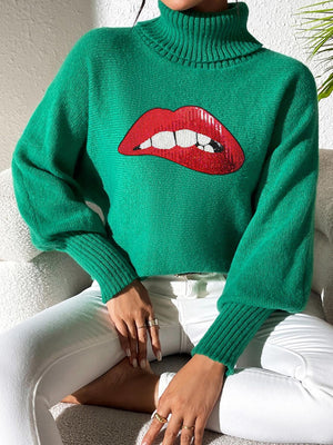 Green turtleneck sweater with sequin red lips detail and balloon sleeves.