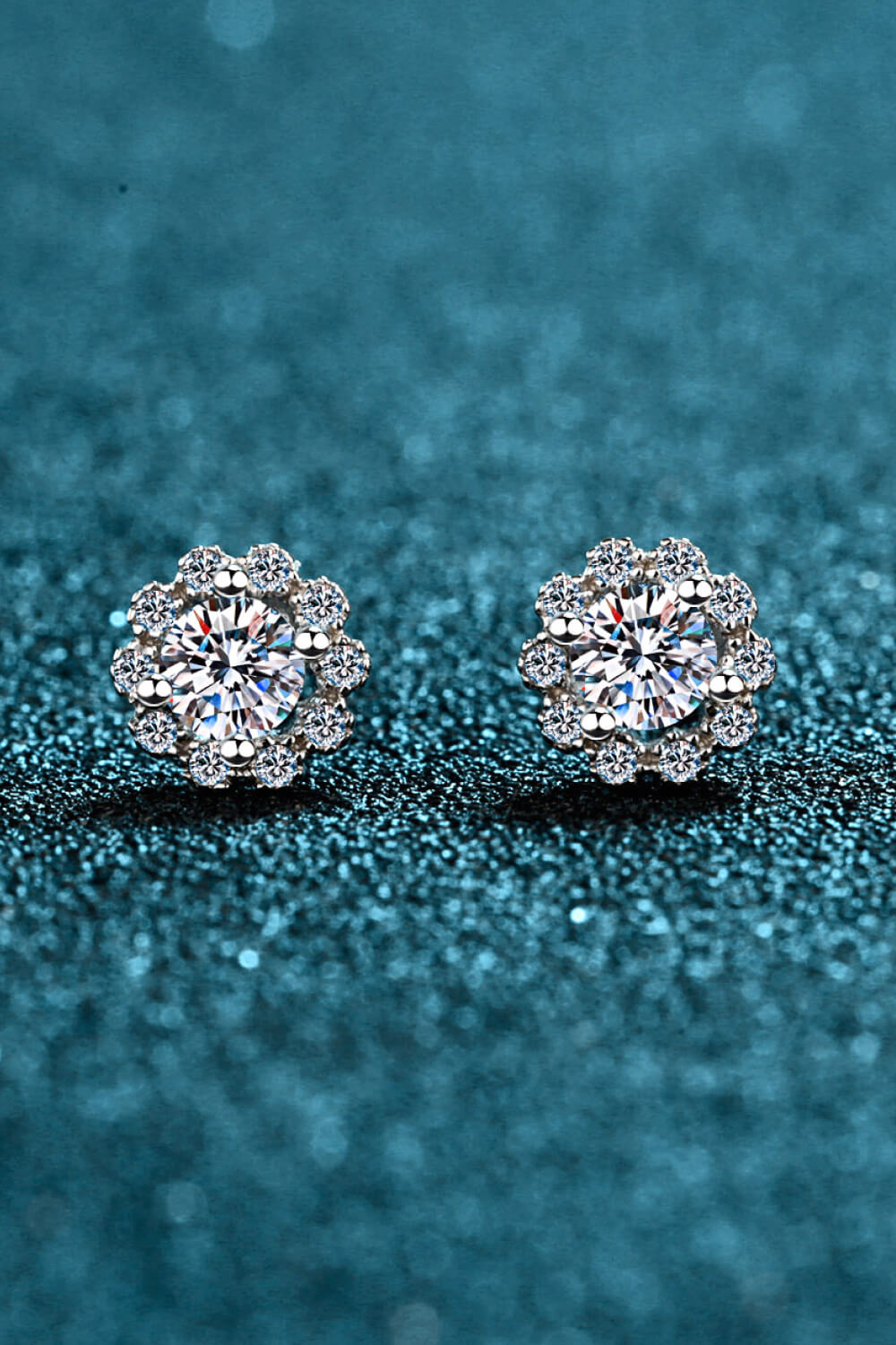 Floral halo stud earrings in 925 sterling silver with brilliant cut stones.