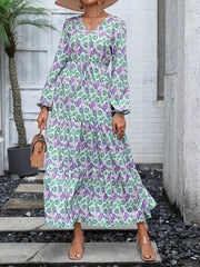 Vibrant paisley print maxi dress with V-neck, balloon sleeves, and drawstring waist.