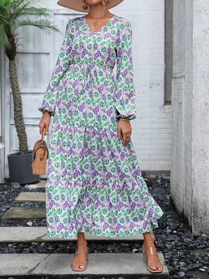 Vibrant paisley print maxi dress with V-neck, balloon sleeves, and drawstring waist.