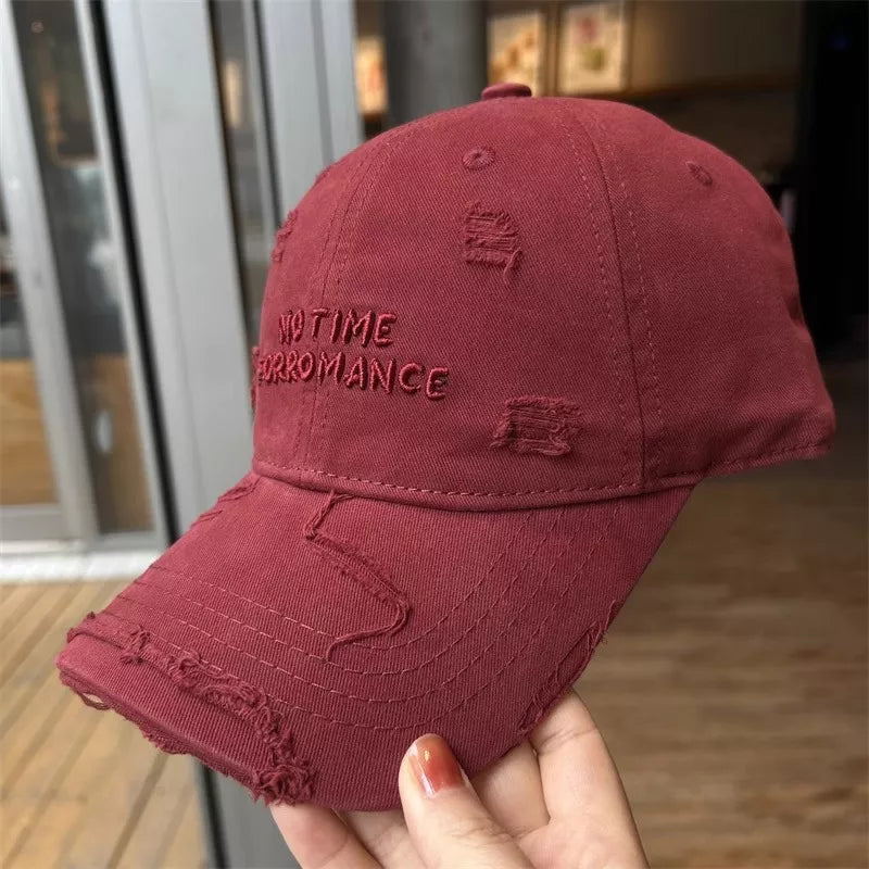 Vintage Red embroidered distressed cotton baseball cap with text detail.