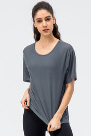 Dark gray honeycomb mesh performance tee with scoop neck and short sleeves.