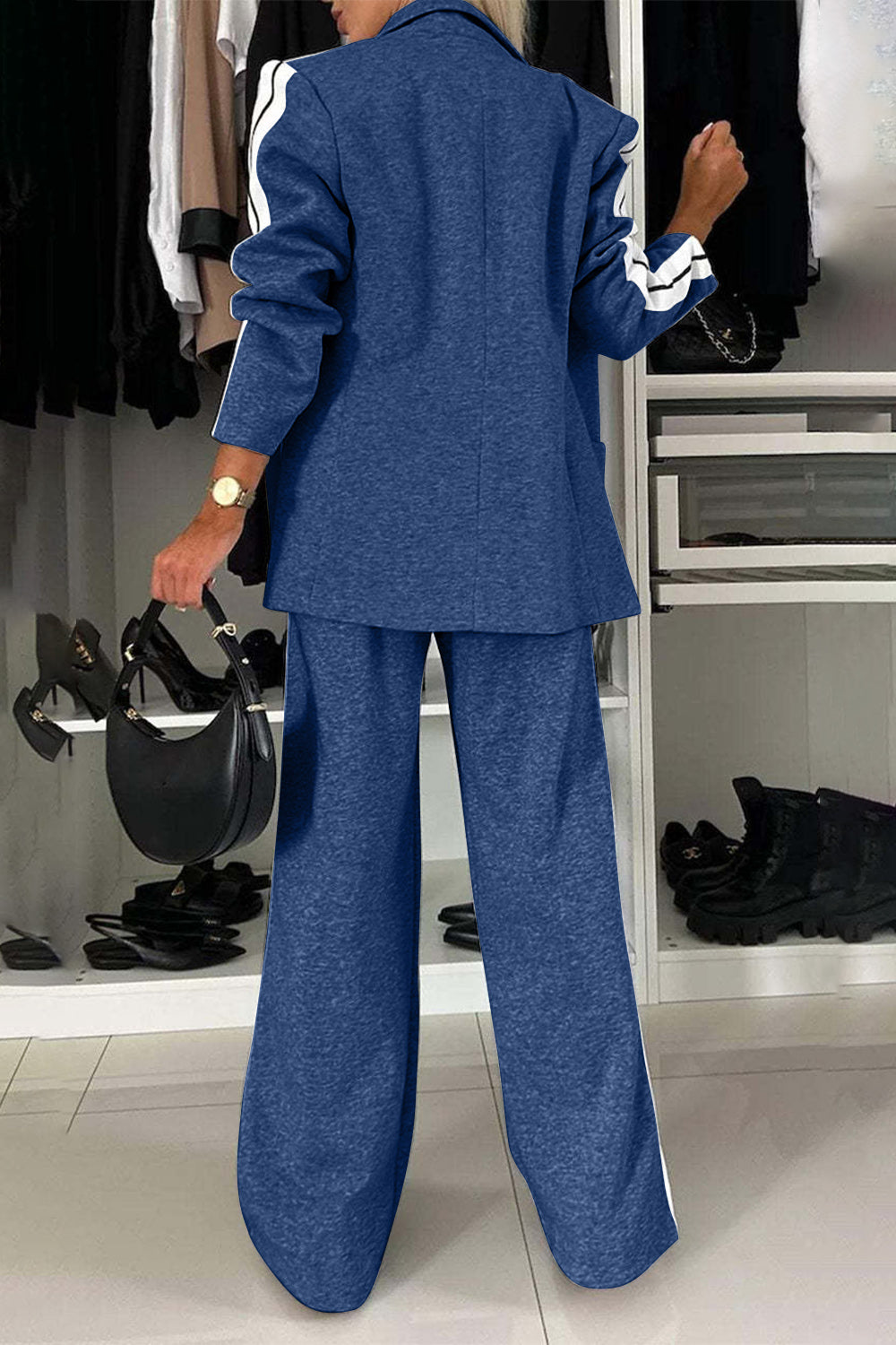 Royal blue track stripe blazer and wide leg trouser set with white stripe detail on sleeves and pant legs.
