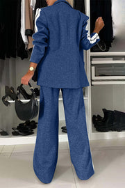 Royal blue track stripe blazer and wide leg trouser set with white stripe detail on sleeves and pant legs.