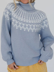 Light blue acrylic turtleneck sweater with white Fair Isle pattern and puff sleeves.