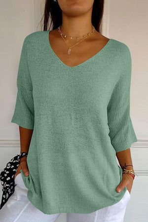 Flared sleeve v-neck knit top in pastel blue with a textured knit and relaxed fit.