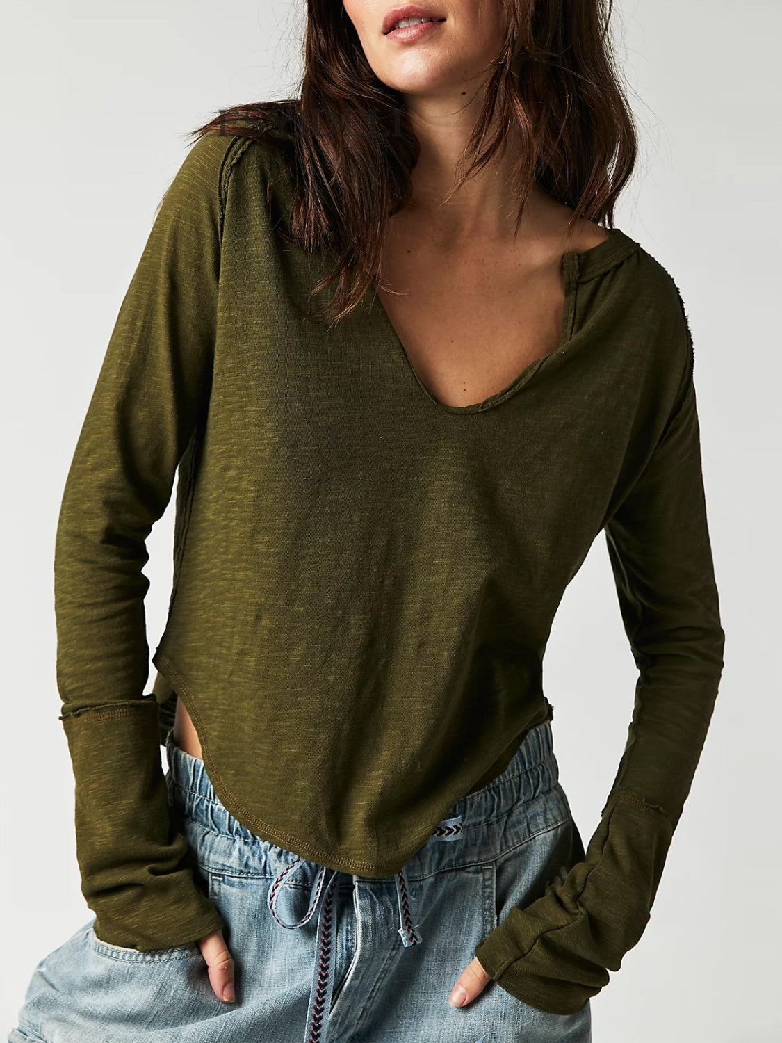 Army green long sleeve tee with distressed slouchy plunge neckline and raw edges