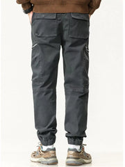 Men's dark gray casual cargo pants with zipper pockets and multiple utility pockets.