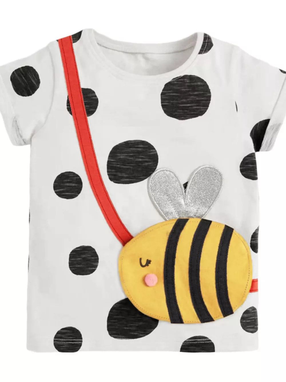 White cotton t-shirt with black polka dots and a yellow bee applique with red suspenders.
