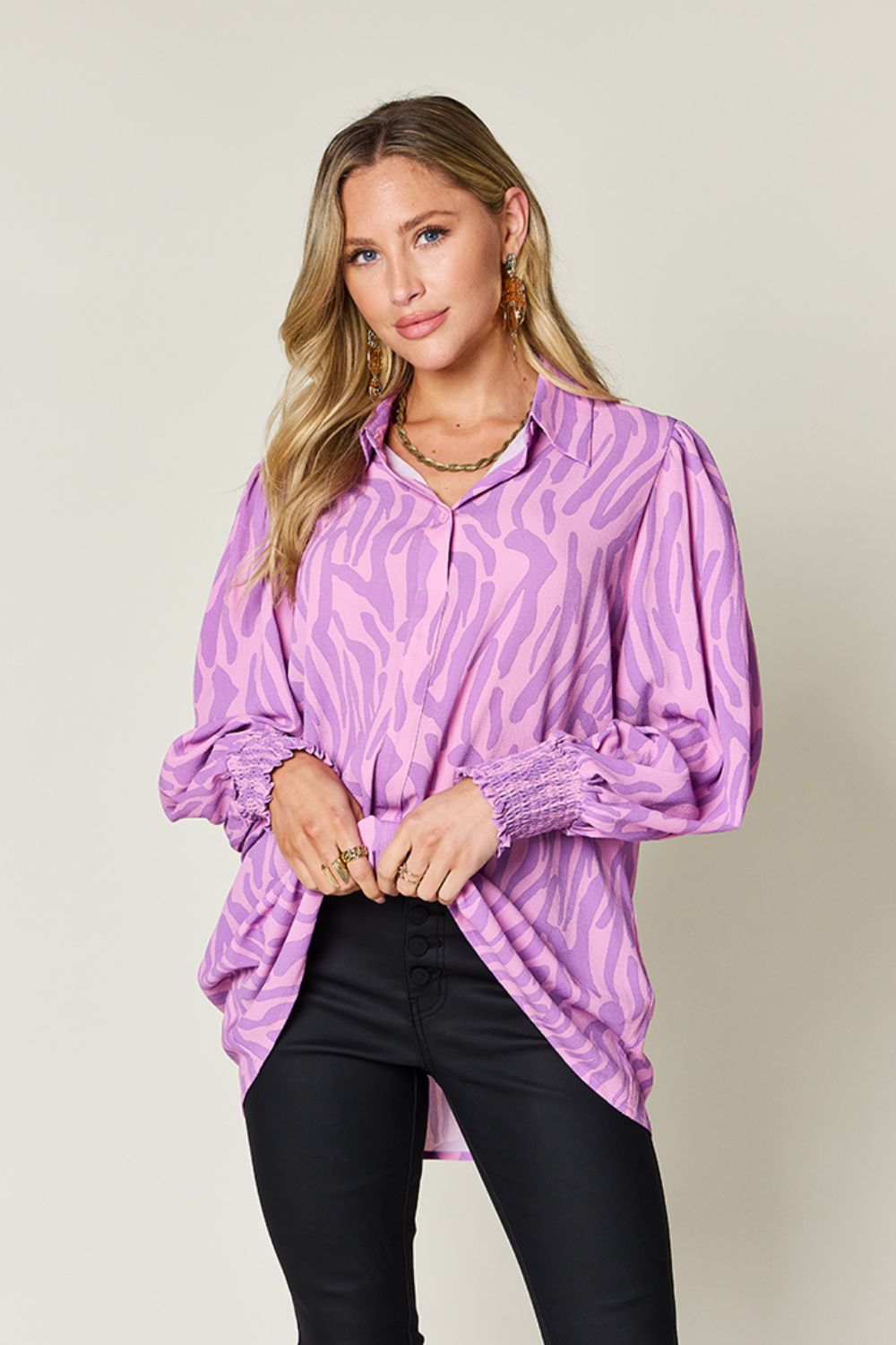 Lavender zebra print blouse with shirred cuffs and puff sleeves.