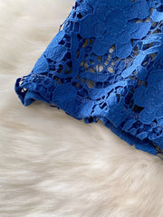 Blue lace-embellished two-piece set with intricate floral detail and scalloped hem.