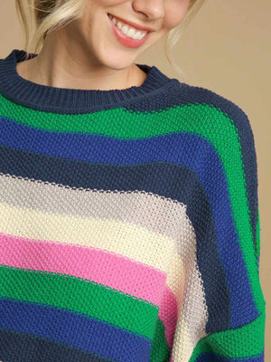 Chunky knit crewneck sweater with horizontal stripes in green, blue, navy, cream, pink, and grey.