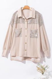 Tan textured knit shirt jacket with sequin details on shoulders and pockets.