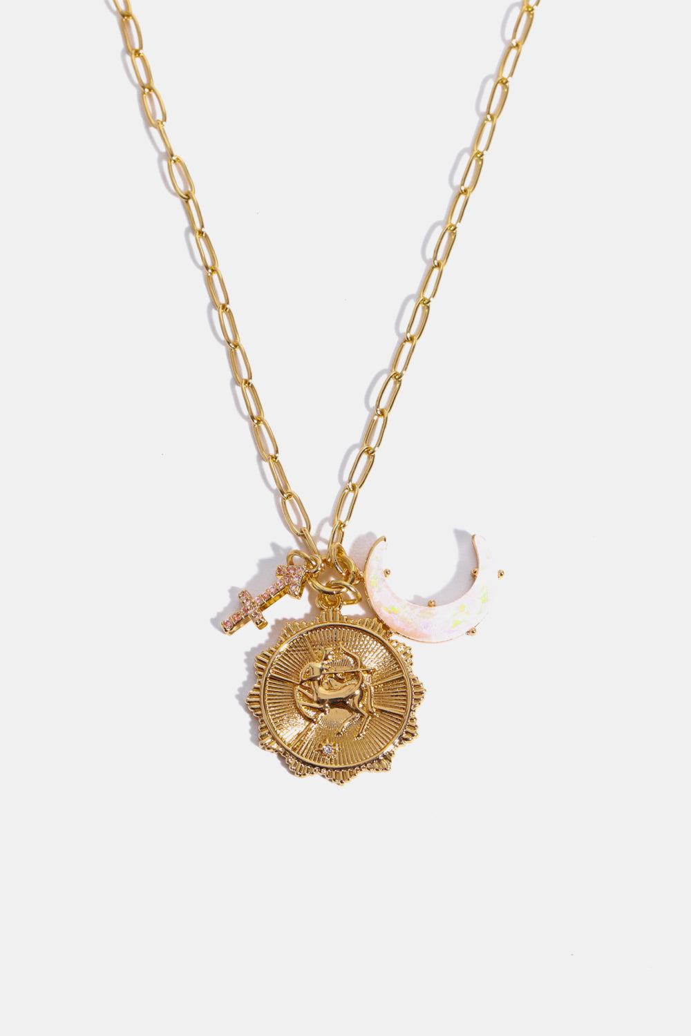 Gold pendant necklace with Sagittarius zodiac sign, crescent moon and cross charms.
