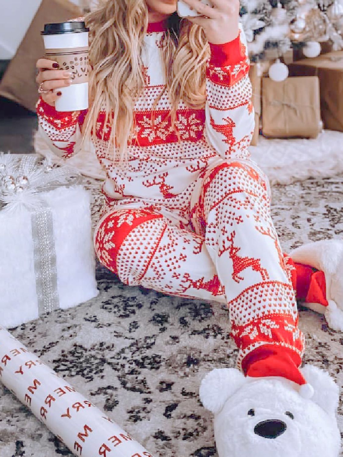 Festive reindeer knit lounge set in orange-red with snowflake and reindeer pattern.
