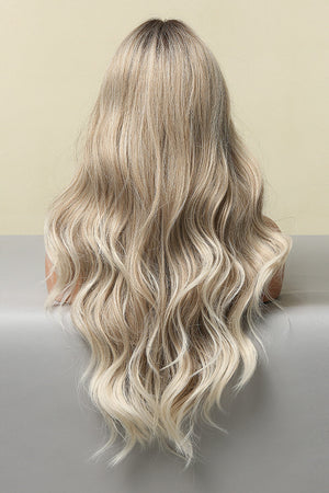 Ombre beach wave wig in light brown/blonde balayage with face framing layers.