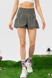Gathered waistline active shorts in Matcha Green with ruffled hem detail.