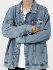 Light blue 100% cotton denim trucker jacket with button-up front and chest pockets.