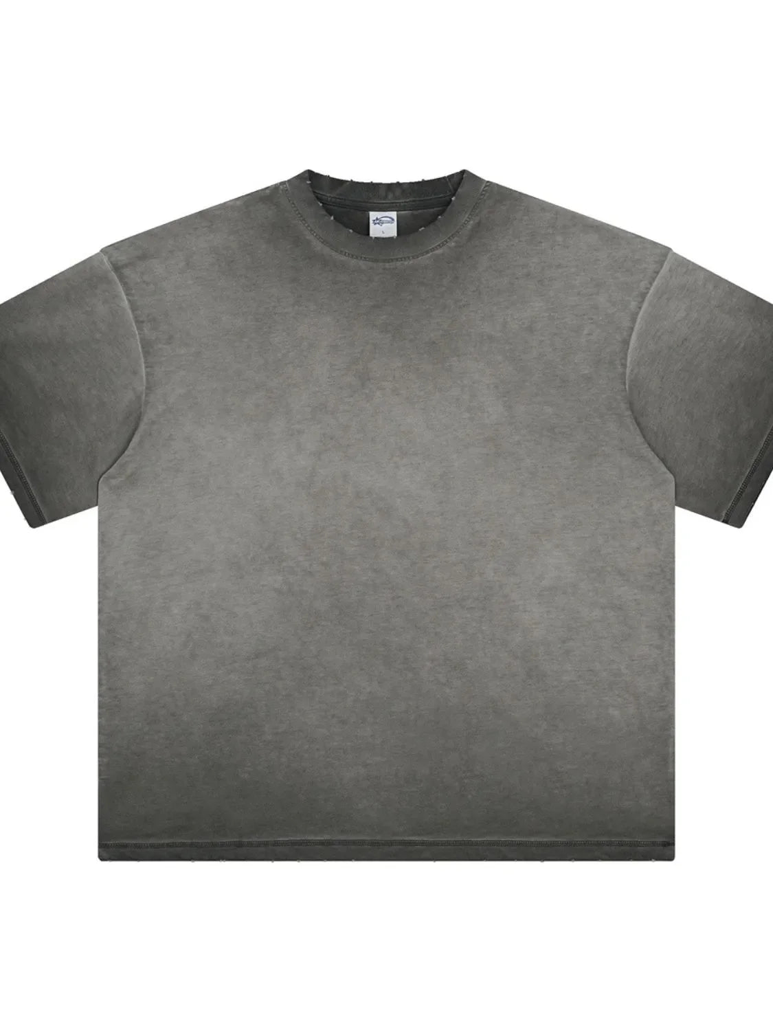 Washed black oversized t-shirt with distressed neckline and raw hem.