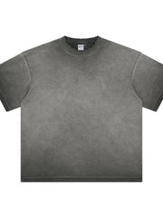 Washed black oversized t-shirt with distressed neckline and raw hem.