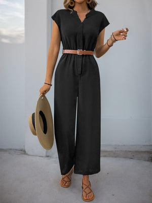 Black cap-sleeve button-down wide-leg jumpsuit with a brown belt and straw hat.