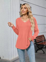 Coral V-neck long sleeve maternity t-shirt with subtle front pleats.
