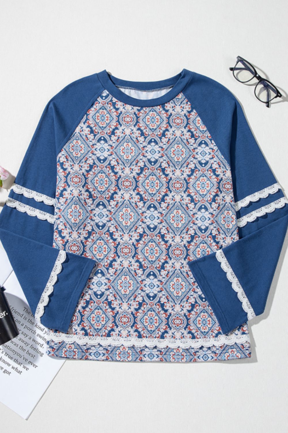 Dusty blue bohemian print blouse with bell sleeves and lace trim