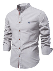Gray linen shirt with mandarin collar, embroidered detail, and buttoned front.