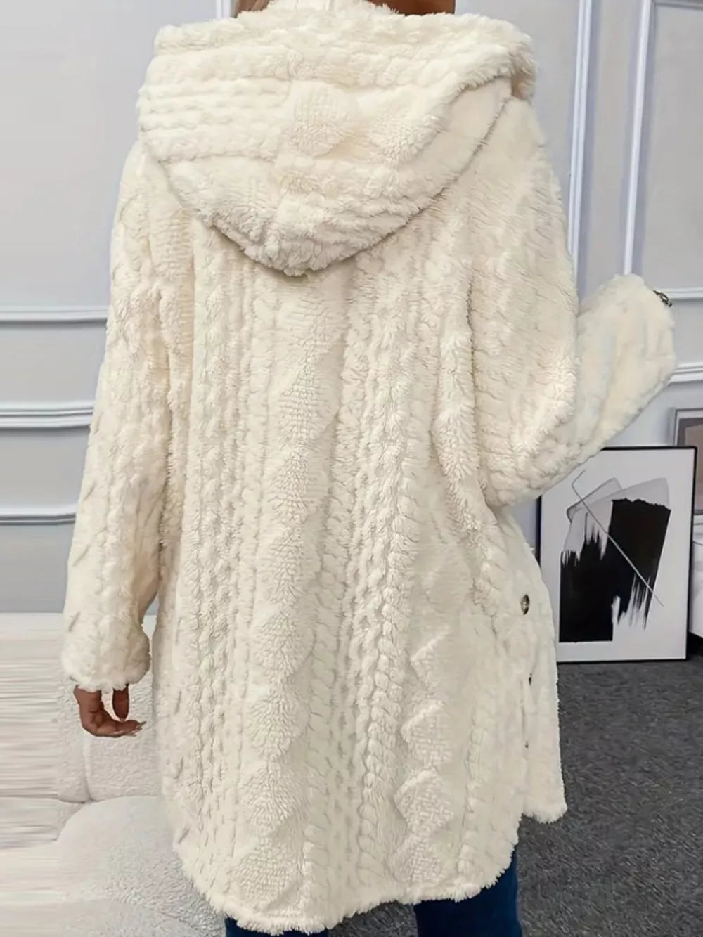 White hooded trench coat with cable knit texture and button detail