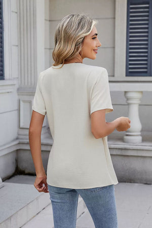 Cream short sleeve blouse with draped front detail, casual basic style.