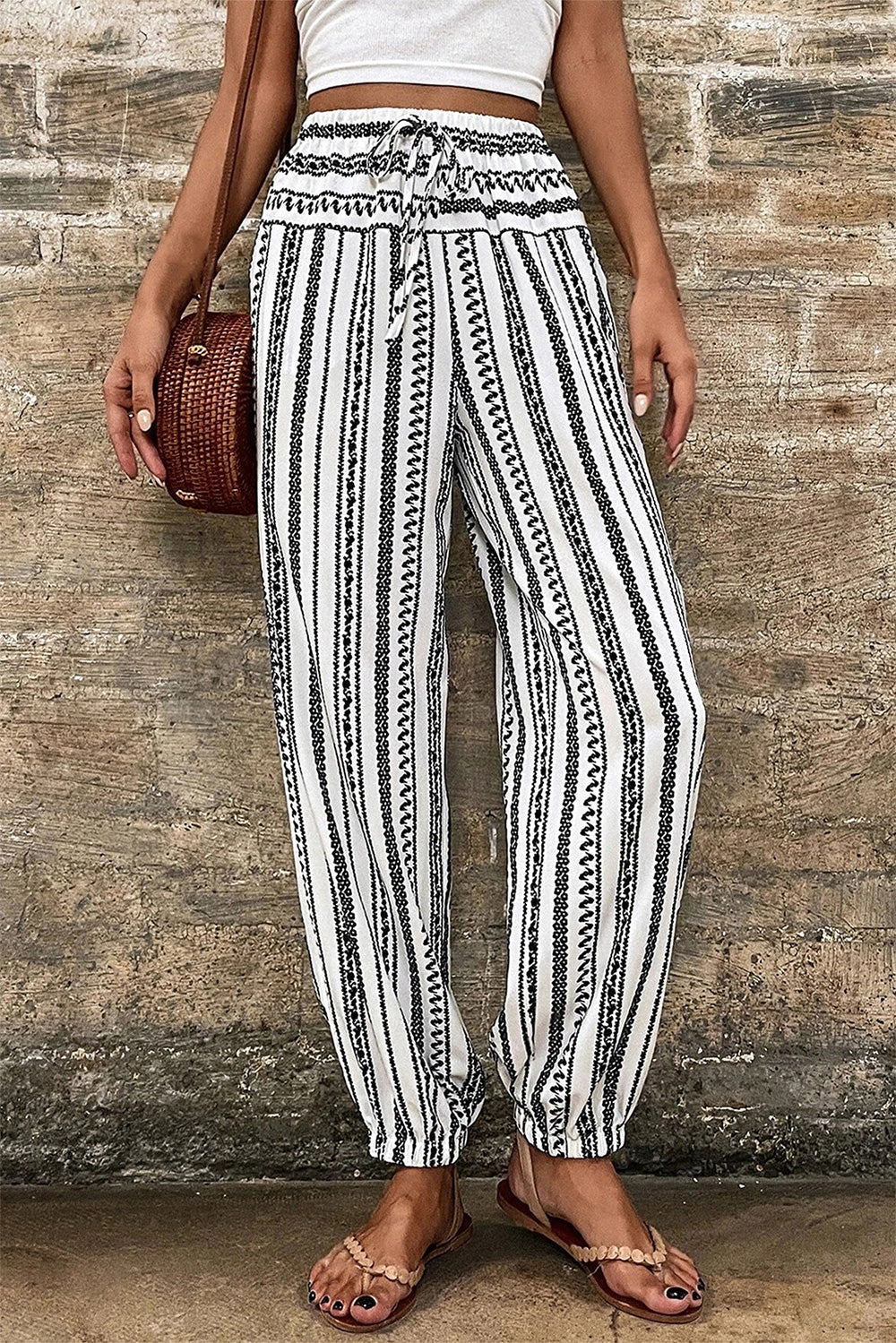 Embroidered stripe drawstring joggers with a relaxed fit and elastic cuffs.