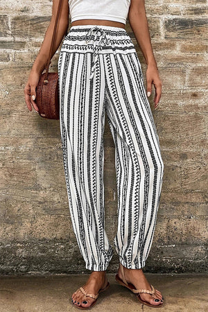 Embroidered stripe drawstring joggers with a relaxed fit and elastic cuffs.