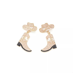 Cowboy hat and boot dangle earrings in ivory white with gold trim and pearl accents.