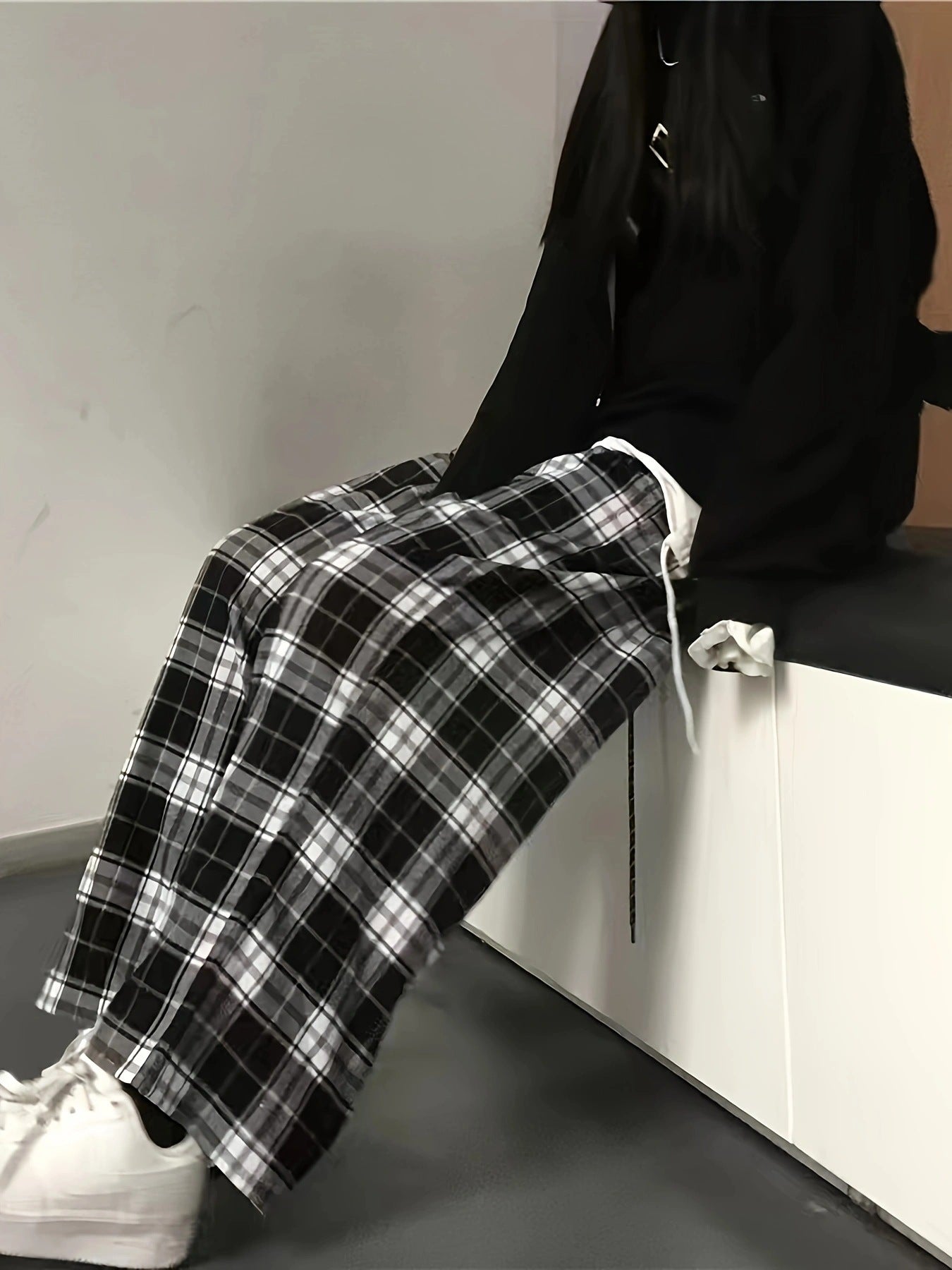 High waist wide leg plaid trousers in black and white cotton with drawstring detail.