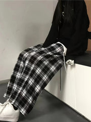 High waist wide leg plaid trousers in black and white cotton with drawstring detail.