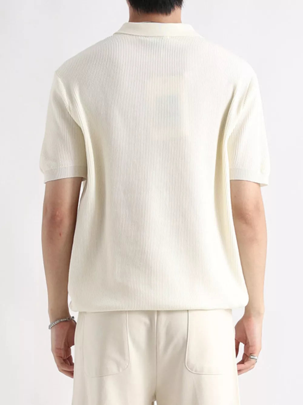 Men's apricot ribbed short sleeve polo shirt with classic collar.