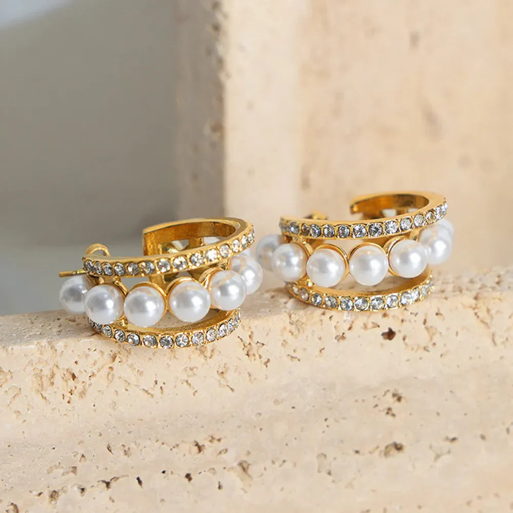 Gold double hoop earrings with pave crystals and pearl accents