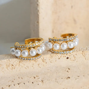 Gold double hoop earrings with pave crystals and pearl accents