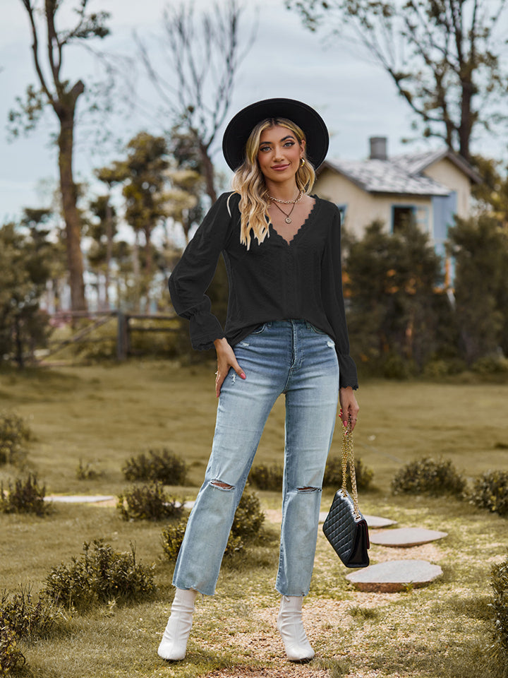Black textured blouse with lace trim V-neck and long sleeves