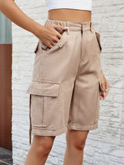 Khaki denim cargo bermuda shorts with buttoned pockets and elastic waistband.