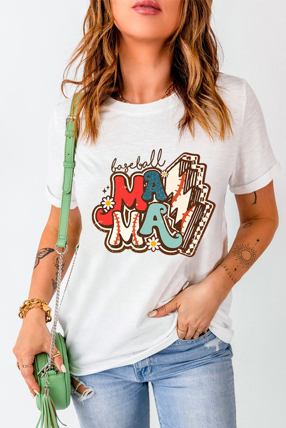 White graphic tee with "baseball Mama" text and baseball graphics.