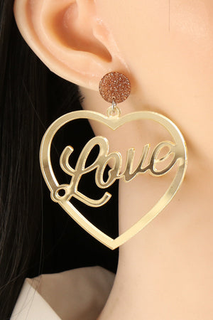 Gold heart earrings with glitter stud and "love" cutout detail
