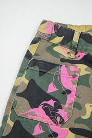 Contrast patchwork floral and leopard print denim jeans with pink floral accents on camouflage.