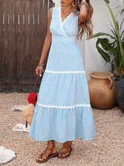 Blue striped midi dress with lace trim and tiered skirt.