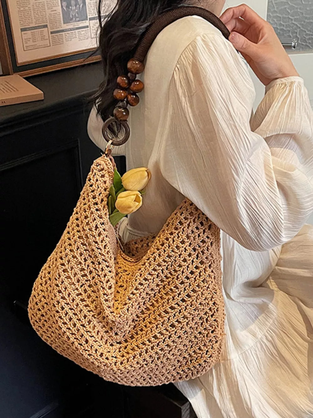 Khaki textured knit shoulder bag with beaded handle and wooden ring detail