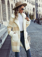 Beige checkered teddy coat with button closure and large front pockets.