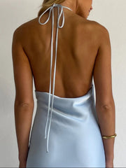 Light blue satin halter maxi dress with open back and tie detail