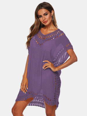 Purple kaftan cover-up with crochet trim and V-neck, perfect for beachwear.