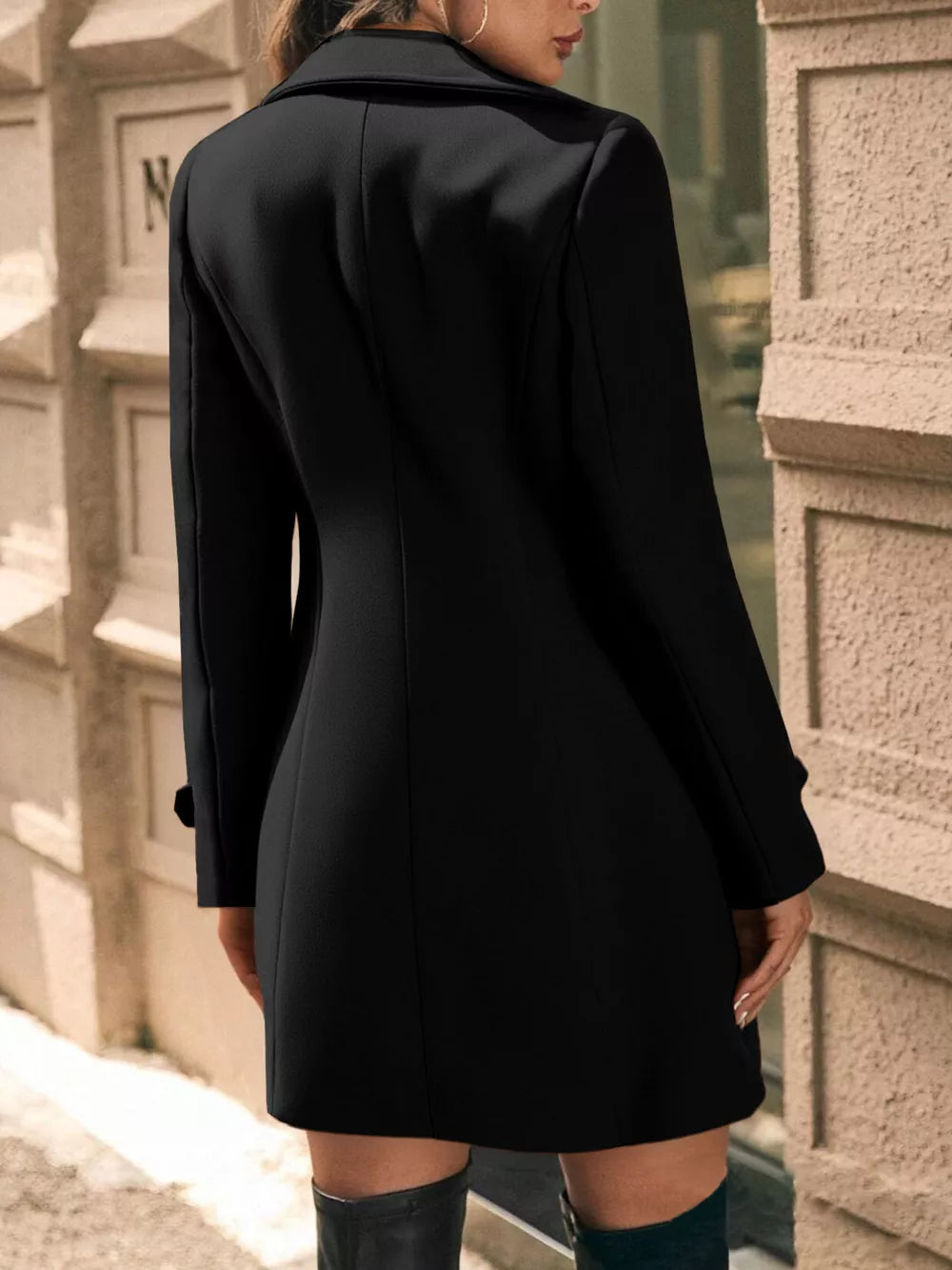 Black double-breasted wool blend trench coat with cuffed sleeves and a-line cut.